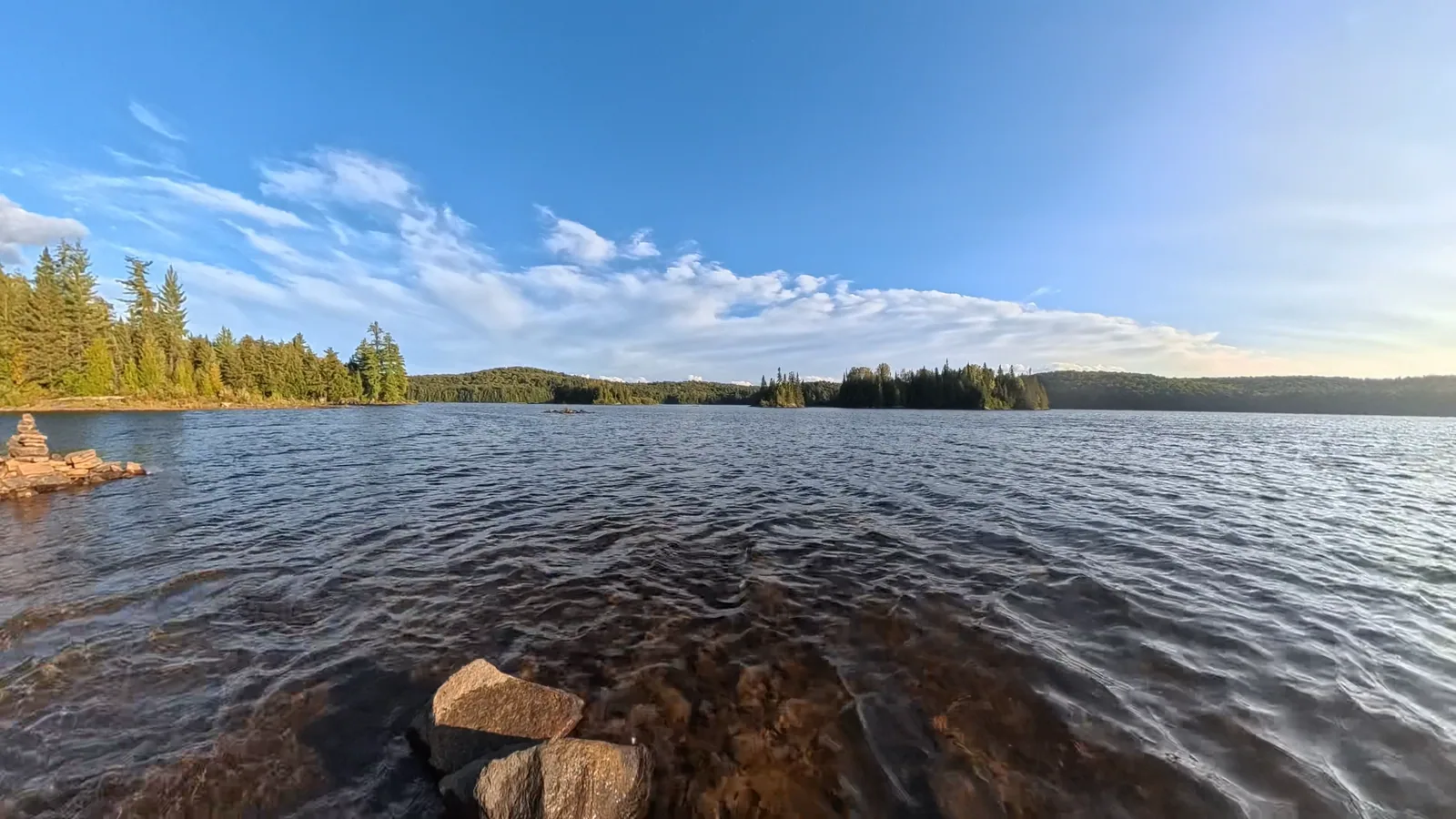 Wide view of Ragged Lake under a blue sky